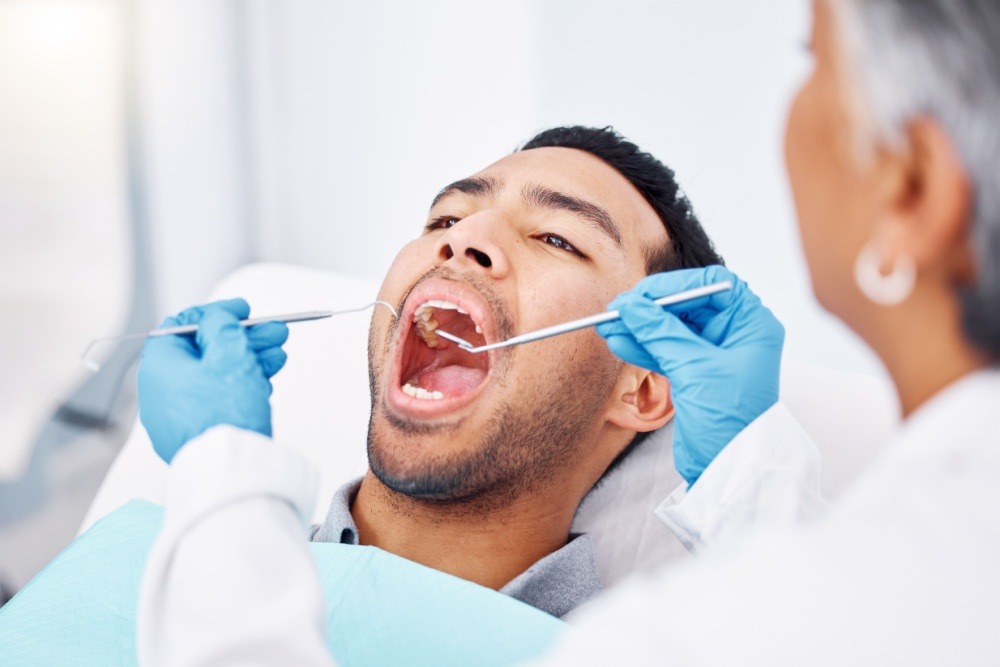man getting a dental cleaning